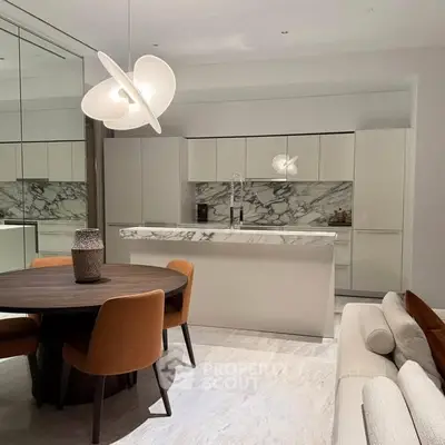 Modern kitchen with marble backsplash and stylish dining area in luxury apartment