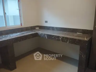 Modern kitchen with sleek marble countertops and ample workspace