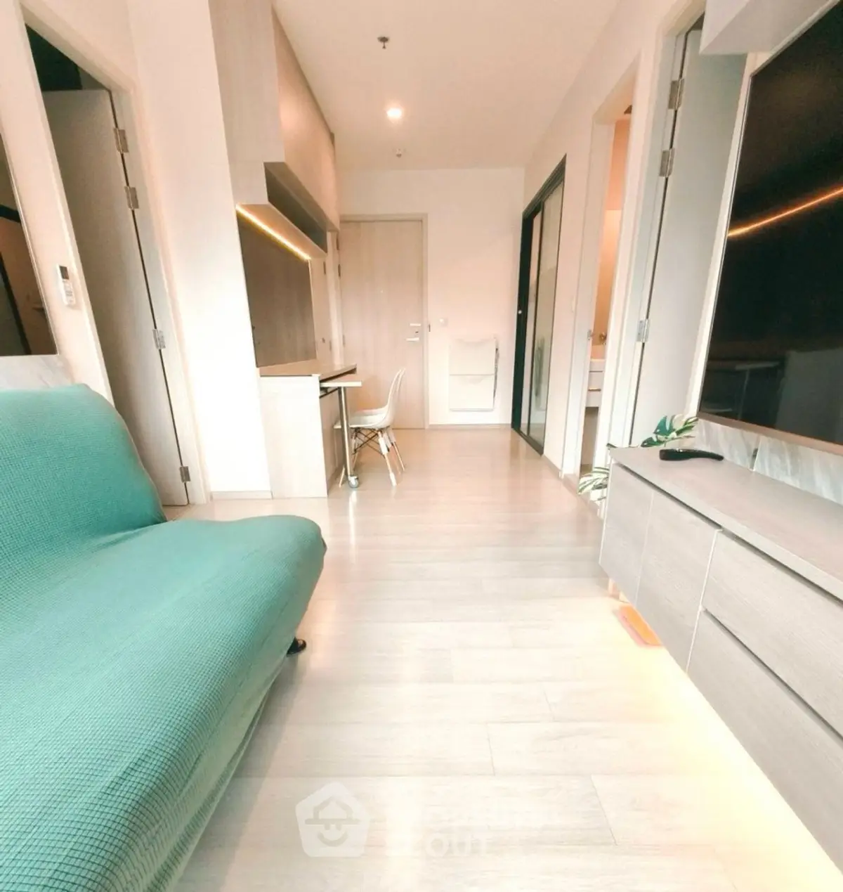 Modern living room with sleek furniture and natural light, perfect for urban living.