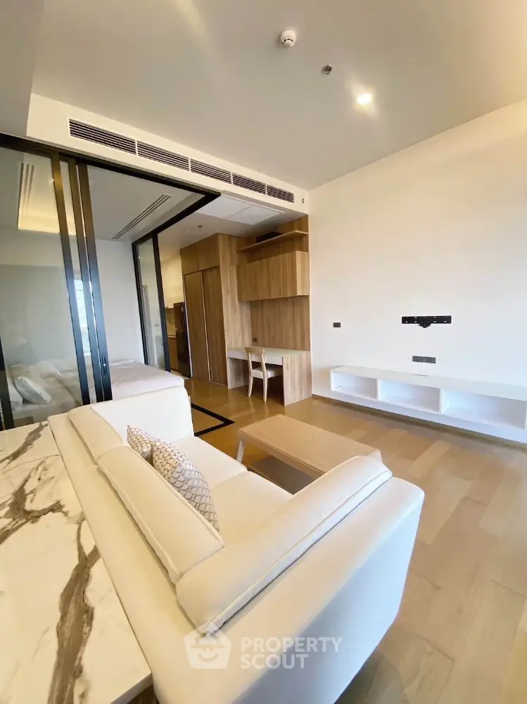 Modern living room with elegant marble table and cozy seating area