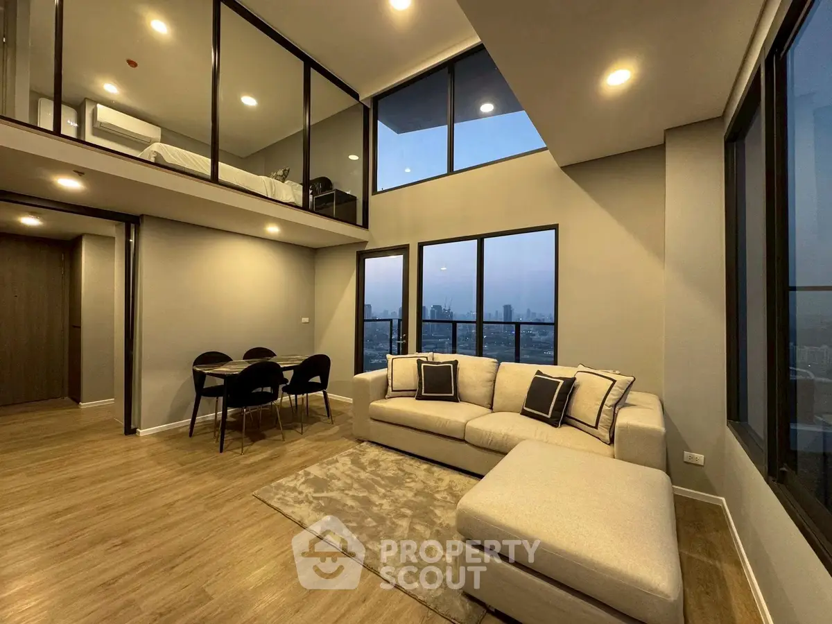 Modern loft apartment with high ceilings and city view