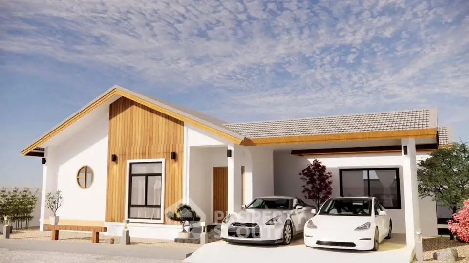Modern single-story house with two-car driveway and wooden accents under a clear sky.