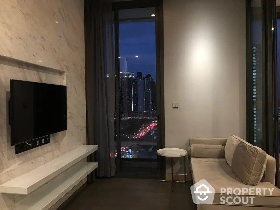 Luxurious high-rise living room with panoramic city views, modern furnishings, and sleek design, perfect for urban lifestyles.