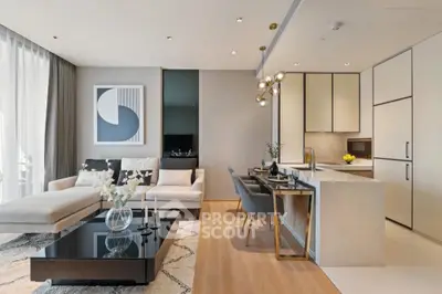 Luxurious modern living room with open kitchen, elegant decor, and natural light.