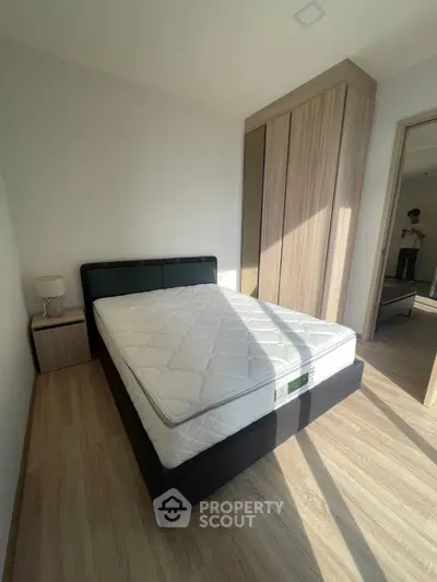 Cozy bedroom with modern design and ample natural light