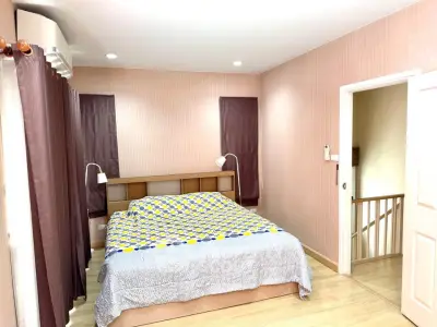 Spacious bedroom with modern decor and natural light
