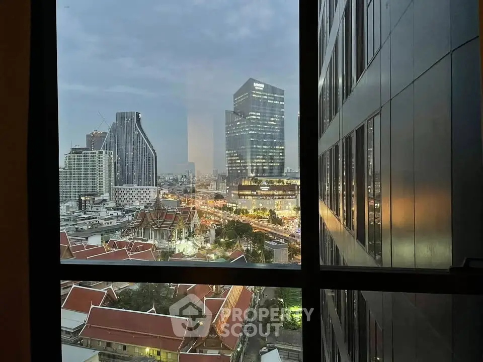 Stunning cityscape view from high-rise window showcasing urban skyline and architectural beauty.