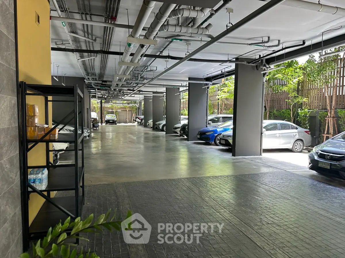 Spacious covered parking area with multiple cars and modern design.