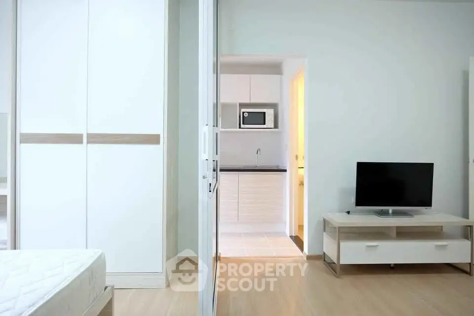 Modern apartment interior with sleek kitchen and cozy living area