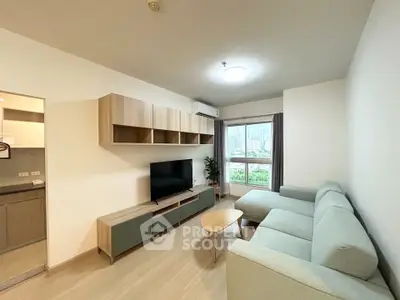 Modern living room with stylish furniture and city view, perfect for urban living.
