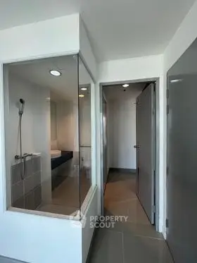 Modern bathroom with glass shower enclosure and sleek design