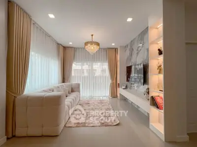 Luxurious living room with elegant chandelier and plush sofa