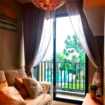 Cozy living room with balcony view and elegant decor