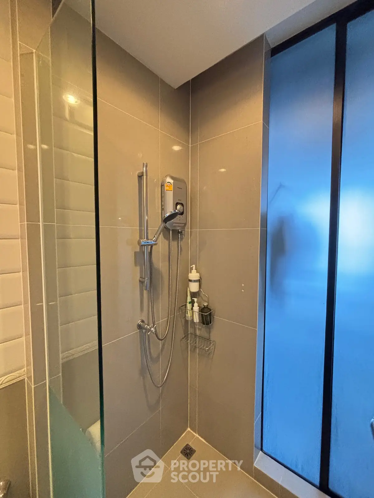 Modern bathroom with sleek shower and frosted glass door