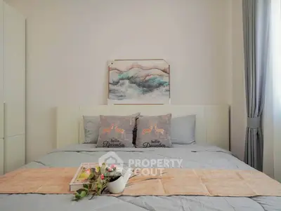 Cozy bedroom with stylish decor and soft lighting, perfect for relaxation and comfort.