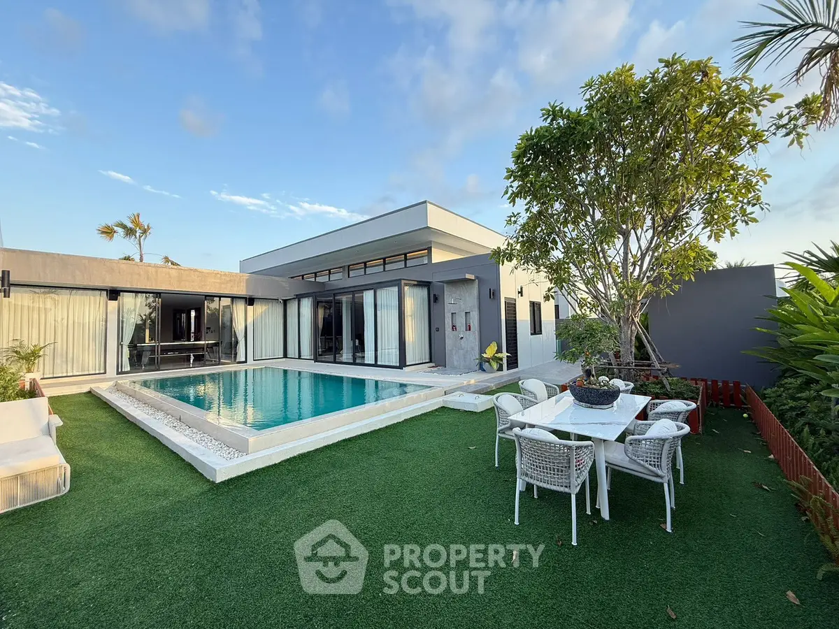 Luxurious modern villa with private pool and lush garden, perfect for relaxation and entertaining.