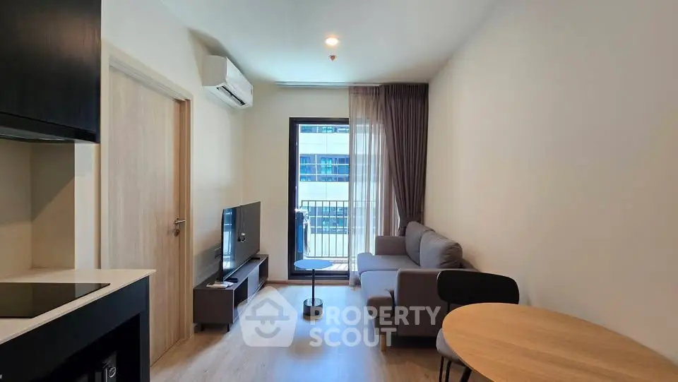 Modern living room with sleek furniture and natural light, perfect for urban living.