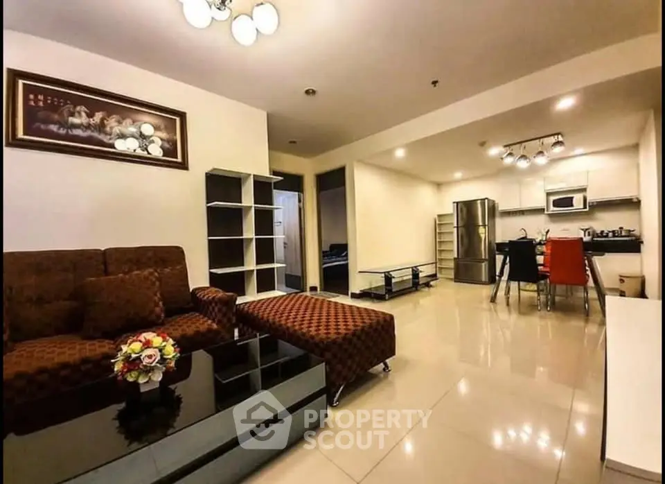 Spacious open-plan living room with modern kitchen and stylish decor