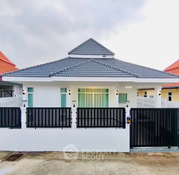 Charming single-story house with modern design and gated entrance