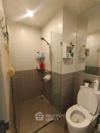 Modern bathroom with glass shower and sleek tile design