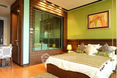 Luxurious bedroom with modern decor and vibrant green accent wall