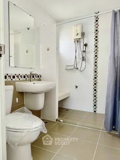 Modern bathroom with shower and sleek tile design