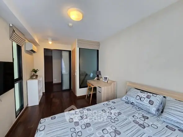 Modern bedroom with stylish decor and natural light