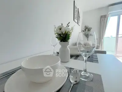 Modern dining area with elegant table setting and natural light