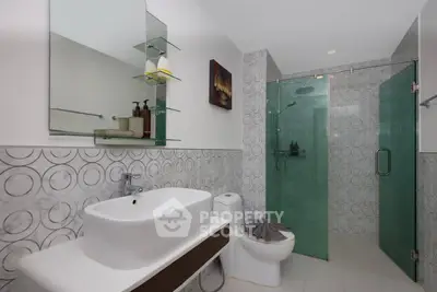 Modern bathroom with stylish glass shower and elegant sink design