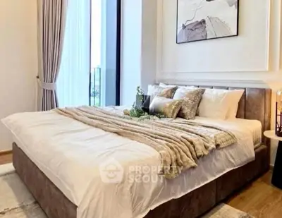 Luxurious bedroom with elegant decor and large window view