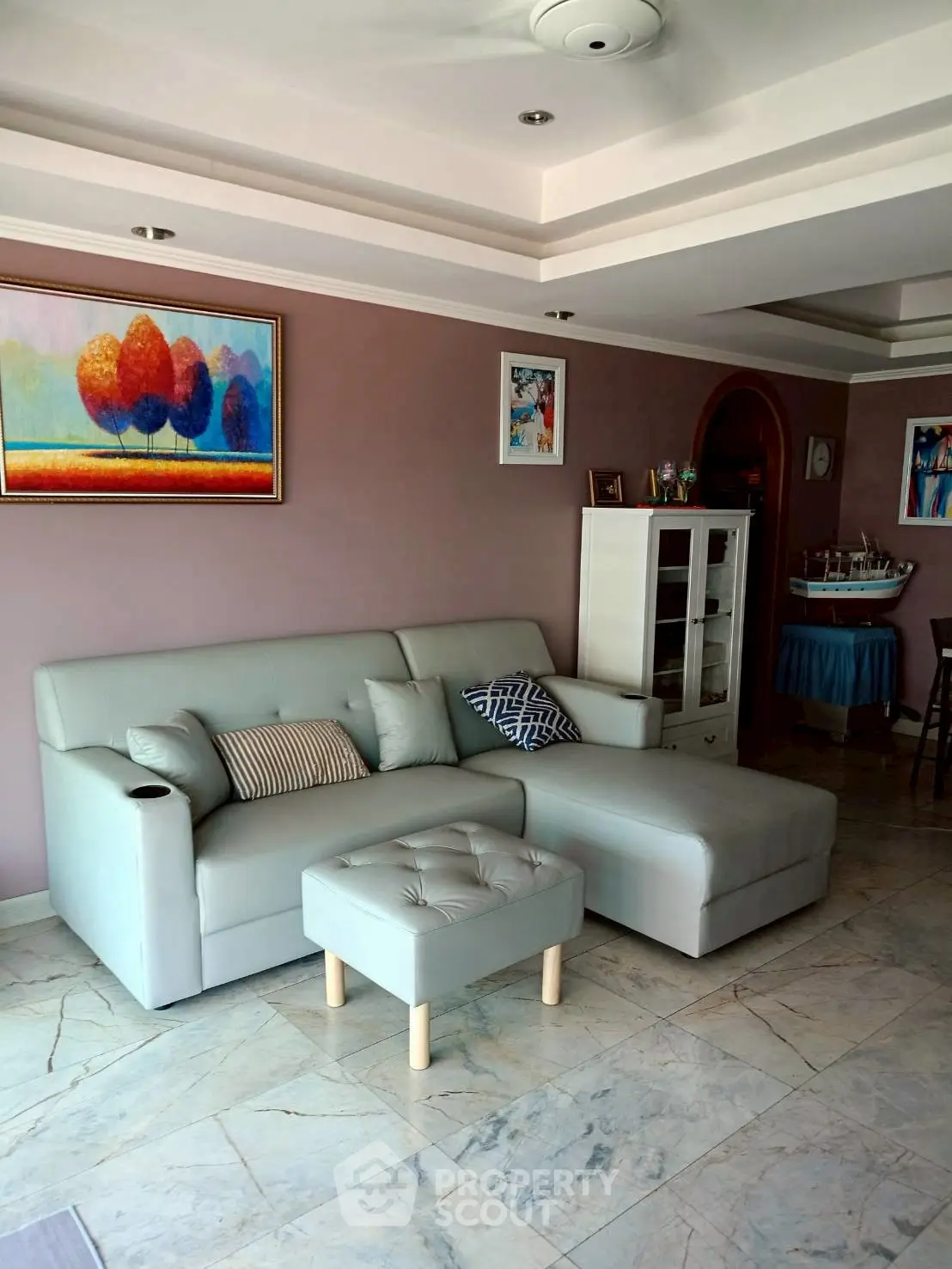 Spacious living room with modern sofa and elegant decor, perfect for relaxation and entertaining.