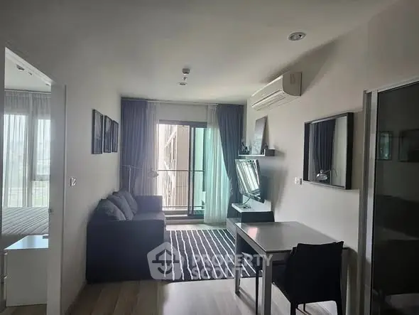 Modern living room with balcony access and stylish decor