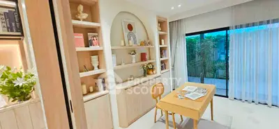 Chic study room with built-in shelves and garden view, perfect for work-from-home setup.