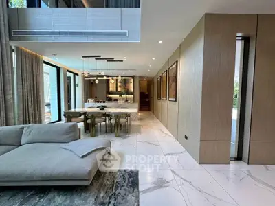 Luxurious modern living room with open layout and elegant dining area