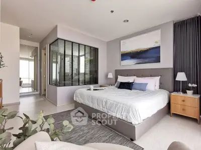 Luxurious modern bedroom with elegant decor and large bed in a stylish apartment.