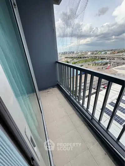 Spacious balcony with city view, perfect for relaxation and enjoying the skyline.