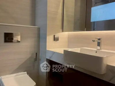 Modern bathroom with sleek fixtures and ambient lighting