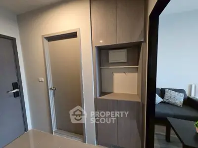 Modern apartment interior with sleek storage and cozy living area