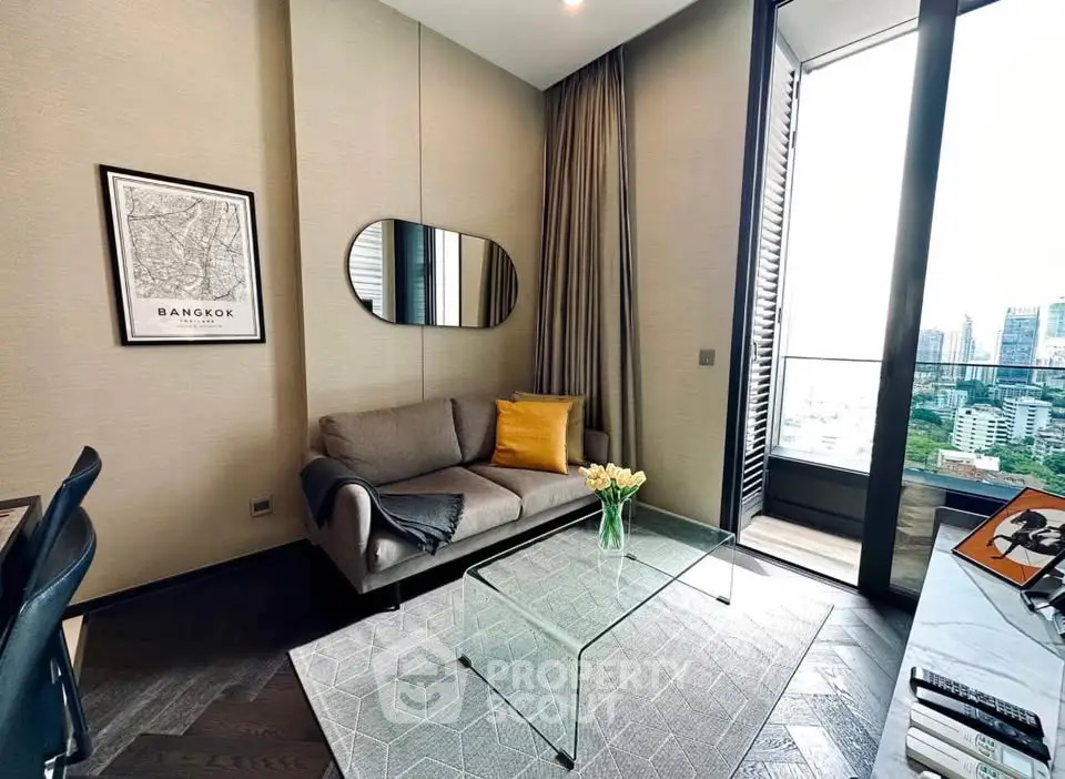 Modern living room with city view, stylish decor, and glass coffee table in Bangkok apartment.