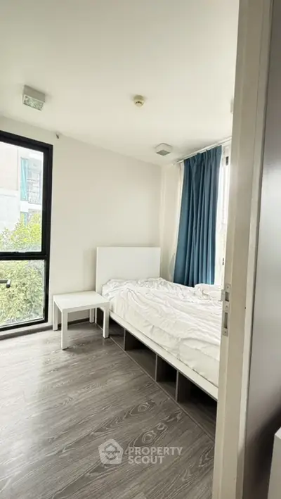 Cozy bedroom with modern design and large window view