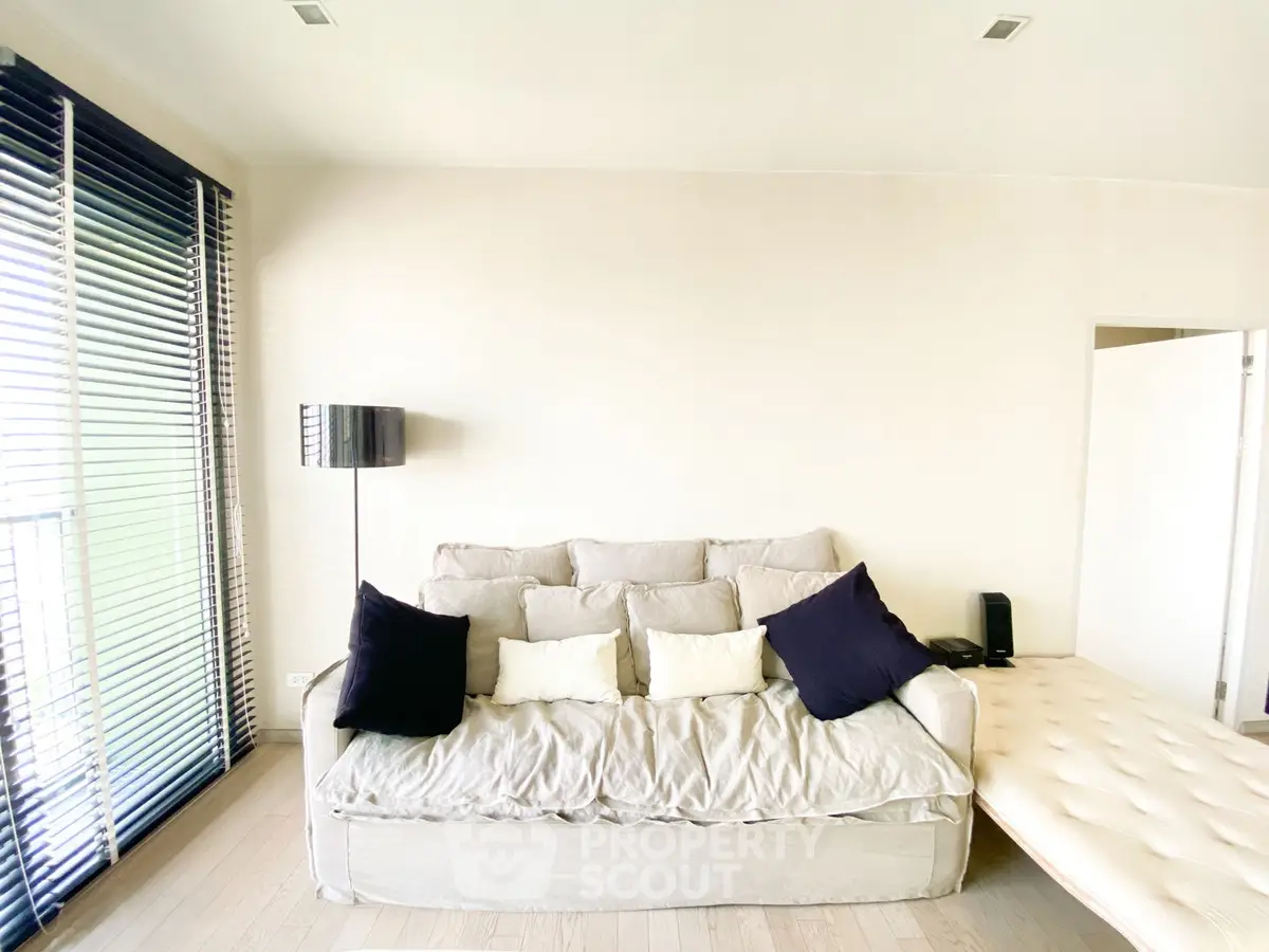 Bright and cozy living room with modern sofa and natural light