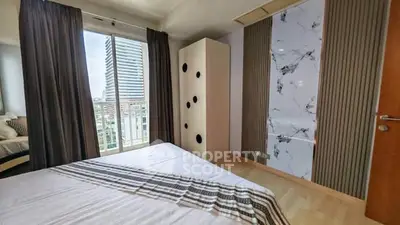 Modern bedroom with city view and stylish decor
