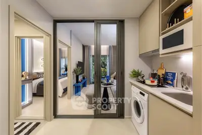 Modern apartment interior with open kitchen and living room, featuring sleek design and natural light.