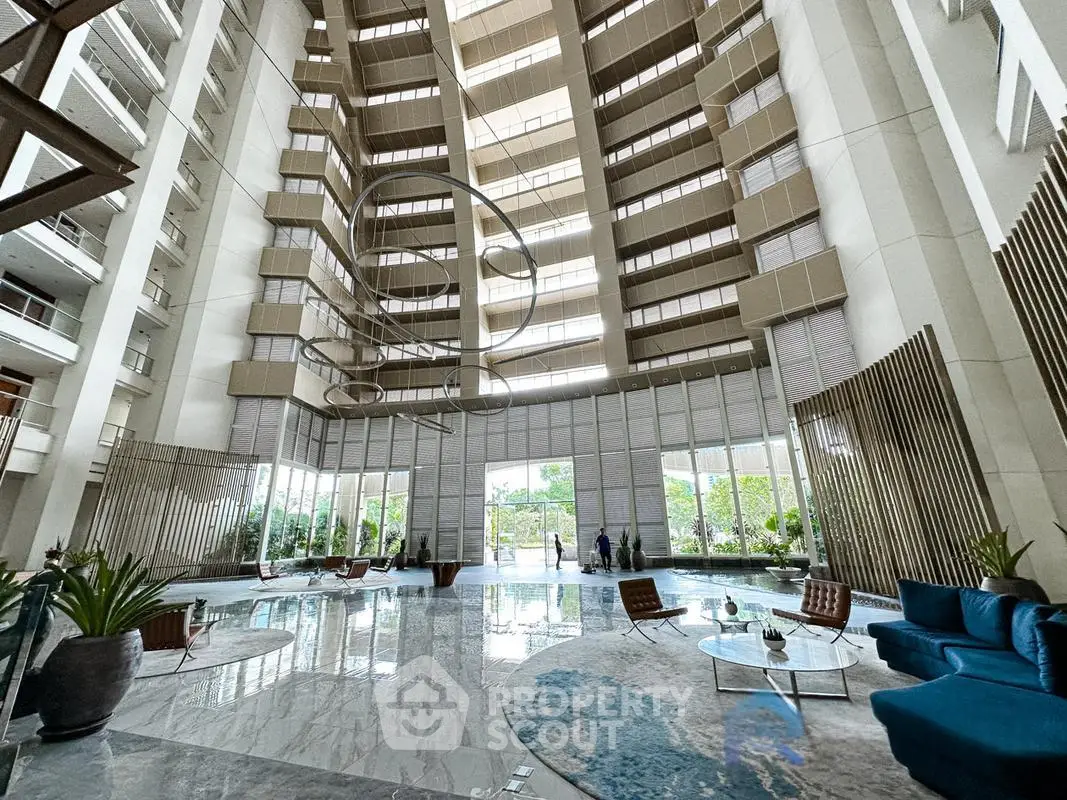 Luxurious modern building lobby with high ceilings and elegant decor