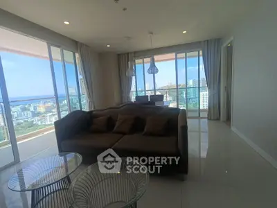 Luxurious living room with panoramic city views and modern furnishings