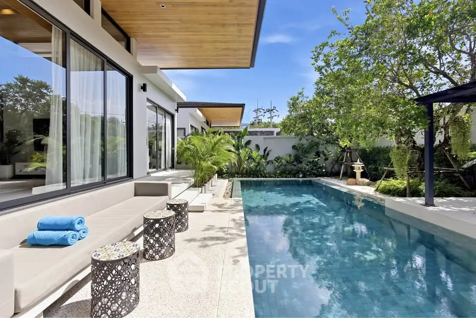 Luxurious modern villa with private pool and lush garden, perfect for relaxation and entertaining.