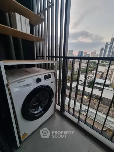 Modern balcony with washing machine and city skyline view, ideal for urban living.