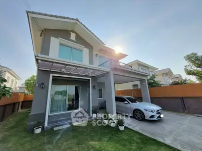 Modern two-story house with carport and landscaped garden