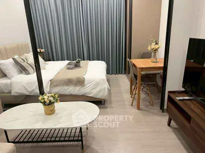 Modern studio apartment with cozy bedroom and stylish living area