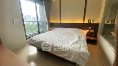 Modern bedroom with balcony view in high-rise apartment